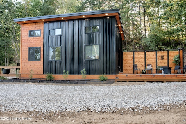 view of outbuilding featuring fence