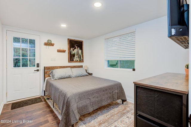 bedroom featuring wood finished floors and recessed lighting