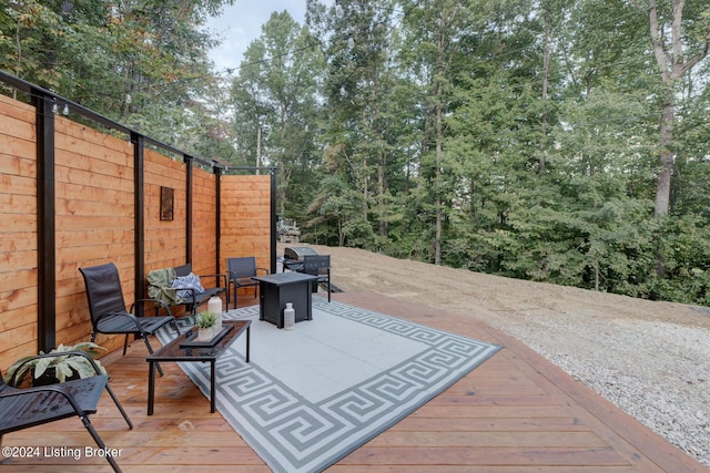 deck featuring a grill