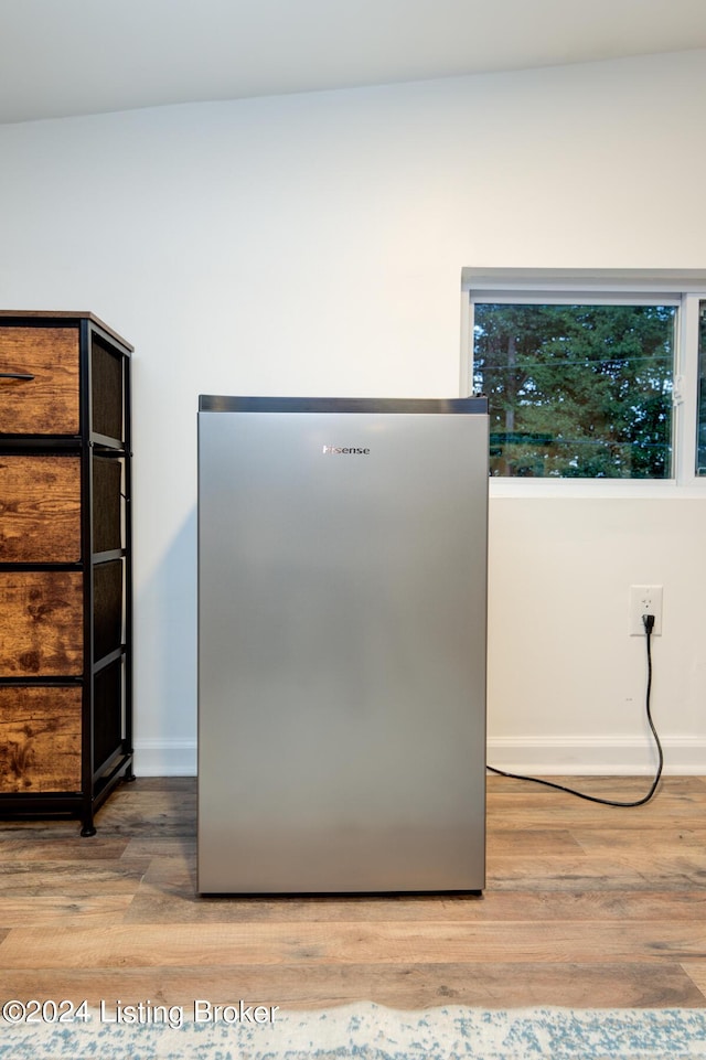 details featuring baseboards and wood finished floors