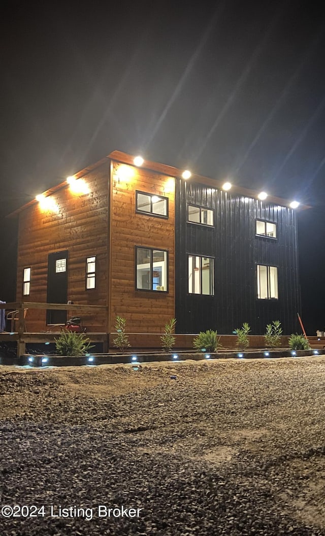 view of property exterior at night