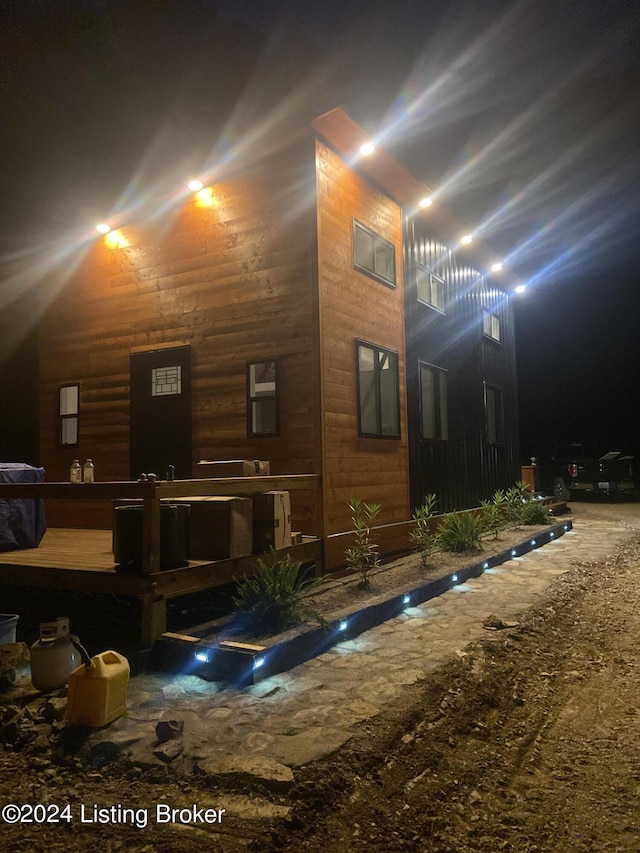 view of property exterior at night