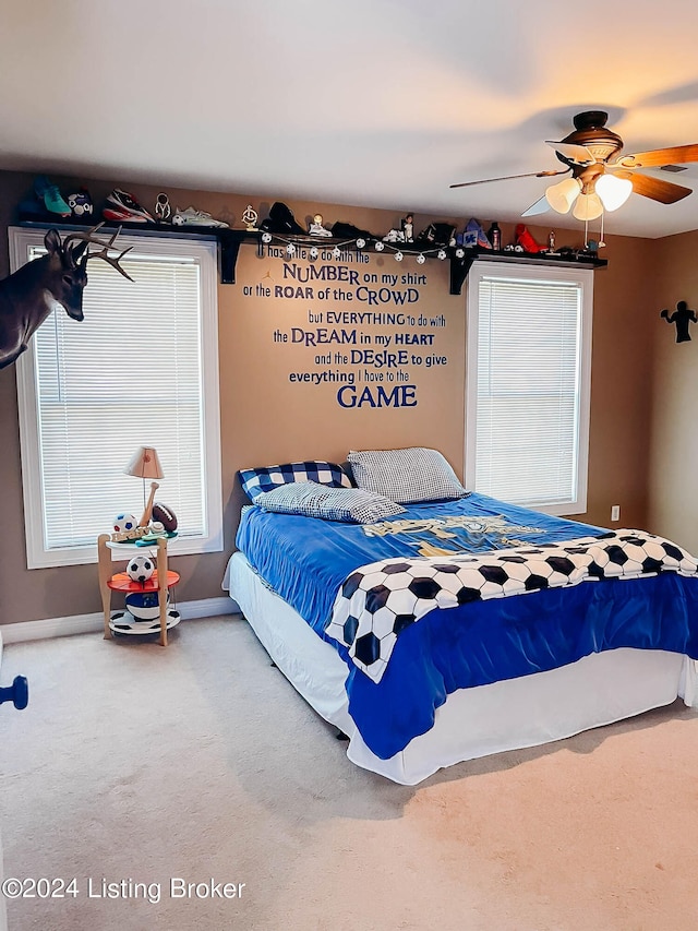 carpeted bedroom featuring ceiling fan