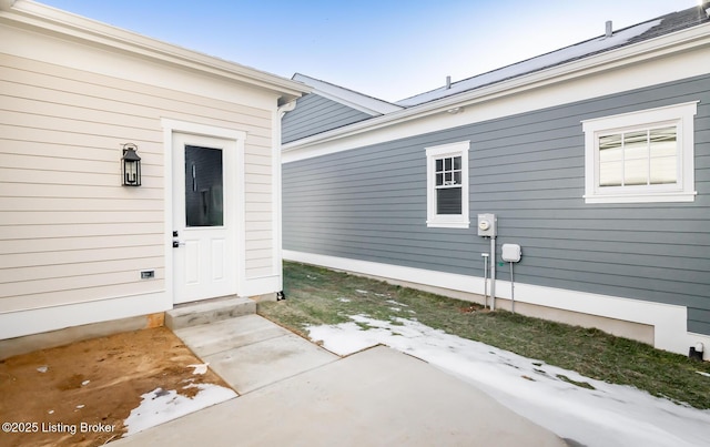 doorway to property featuring a patio area