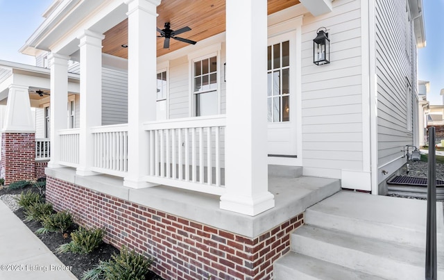 doorway to property featuring a porch and ceiling fan