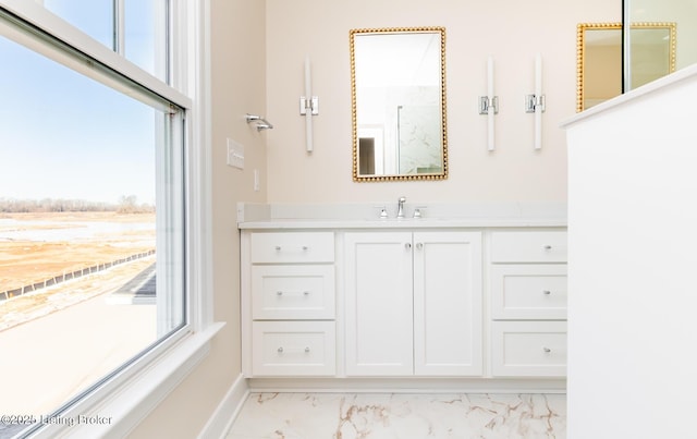 bathroom with vanity and a healthy amount of sunlight