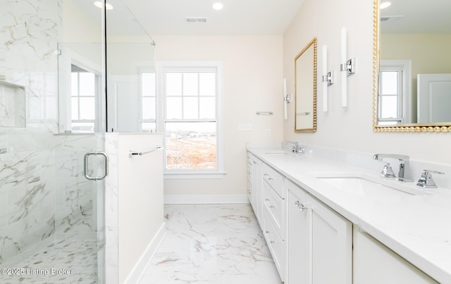 bathroom featuring vanity and an enclosed shower