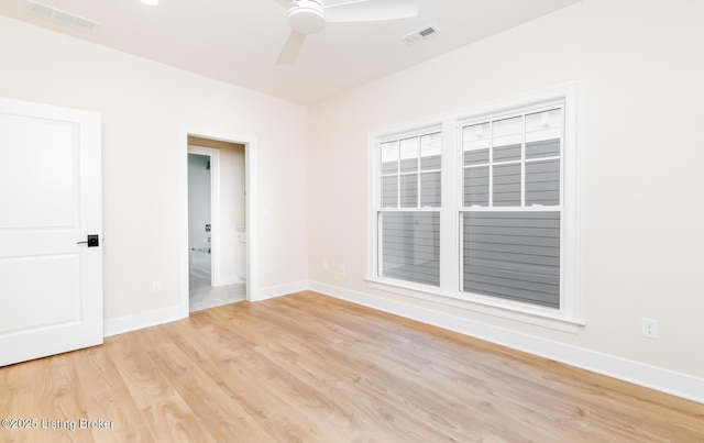 empty room featuring ceiling fan and light wood-type flooring