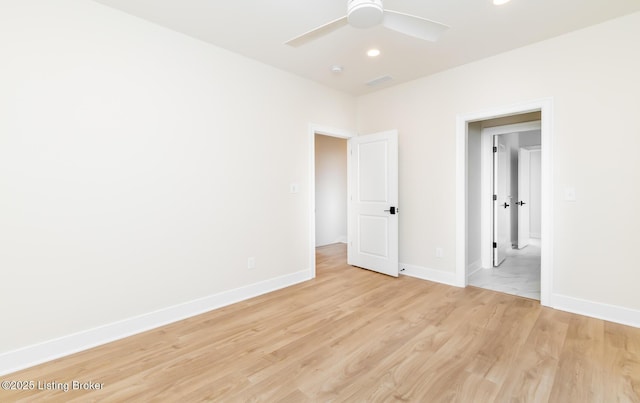 unfurnished bedroom with ceiling fan and light wood-type flooring