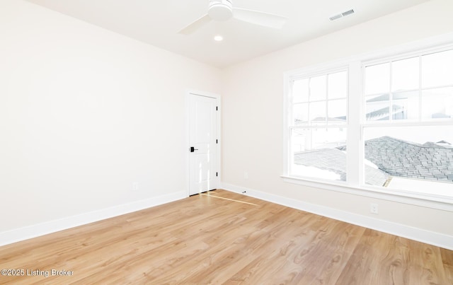 unfurnished room with ceiling fan and wood-type flooring