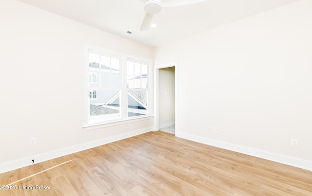 empty room with light hardwood / wood-style floors and ceiling fan