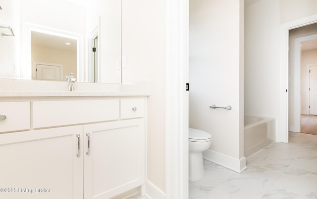 bathroom with a tub to relax in, toilet, and vanity