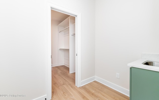 interior space featuring sink and light hardwood / wood-style floors