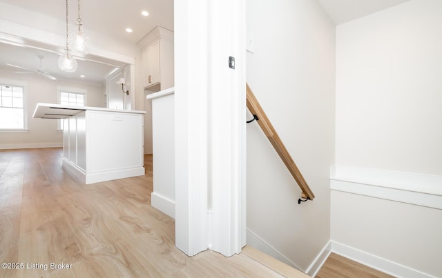 stairs featuring hardwood / wood-style flooring