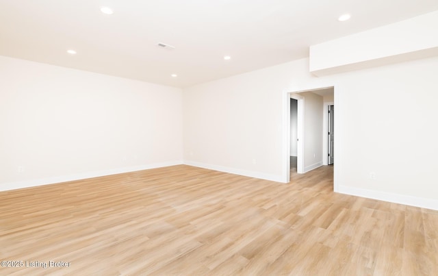 spare room with light hardwood / wood-style flooring