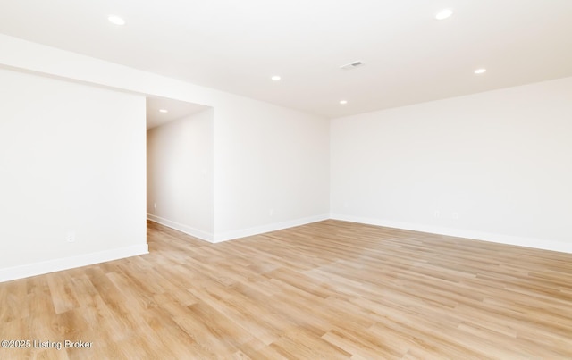 unfurnished room with light hardwood / wood-style flooring