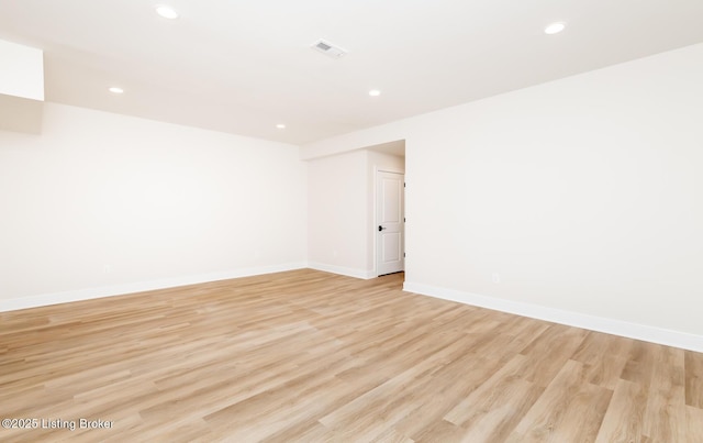 spare room with light hardwood / wood-style floors