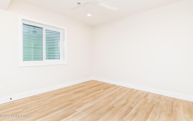 unfurnished room with ceiling fan and light wood-type flooring