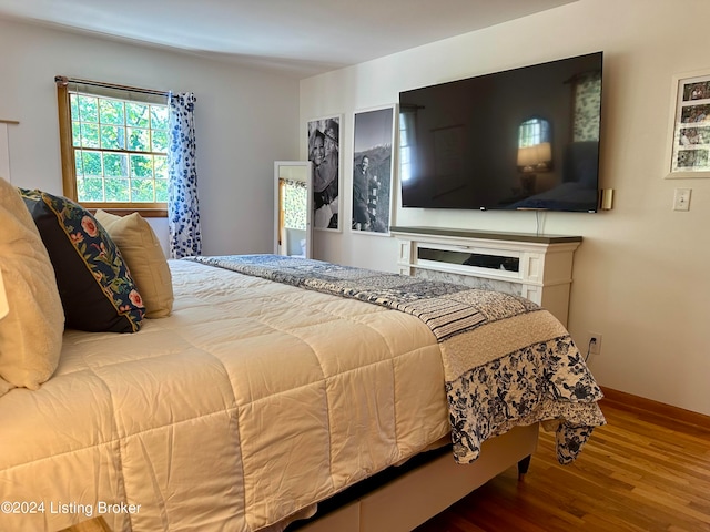 bedroom featuring wood-type flooring