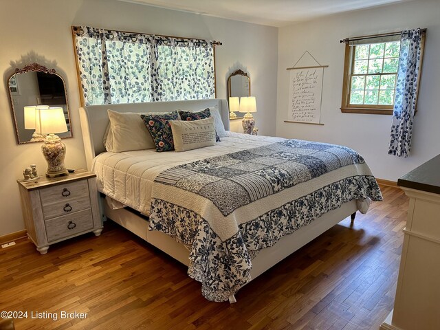 bedroom with wood-type flooring