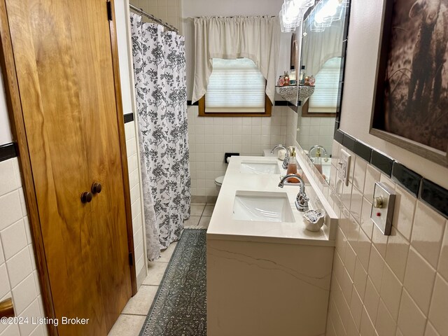 bathroom featuring tile walls, tile patterned floors, vanity, and toilet