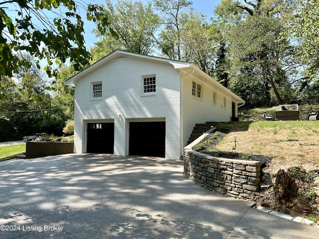 view of property exterior with a garage