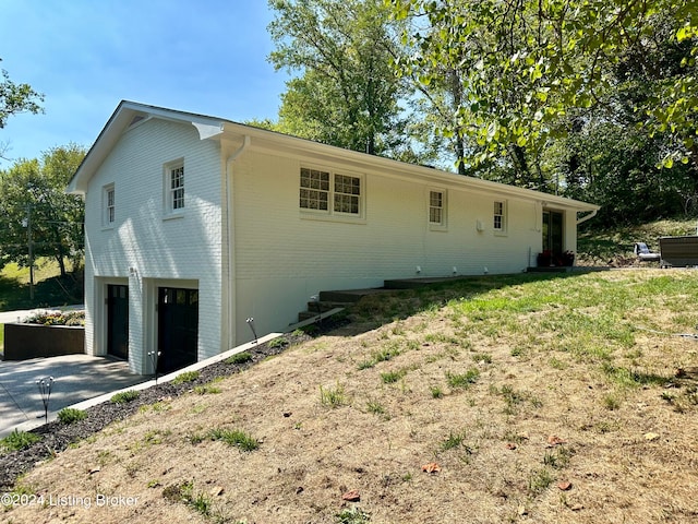 view of property exterior with a garage