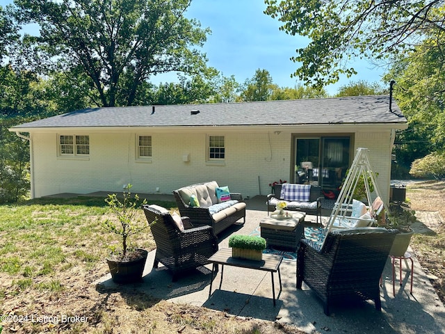 back of house featuring outdoor lounge area and a patio area