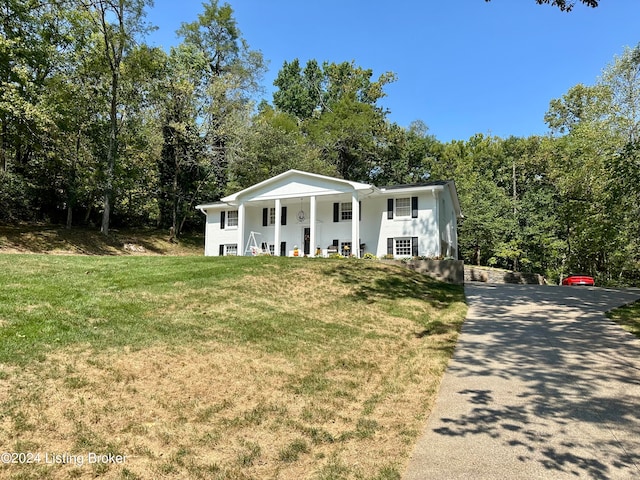 view of front of house with a front lawn and covered porch