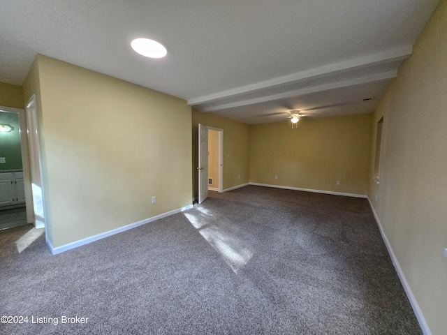 unfurnished room featuring beam ceiling, ceiling fan, and carpet floors