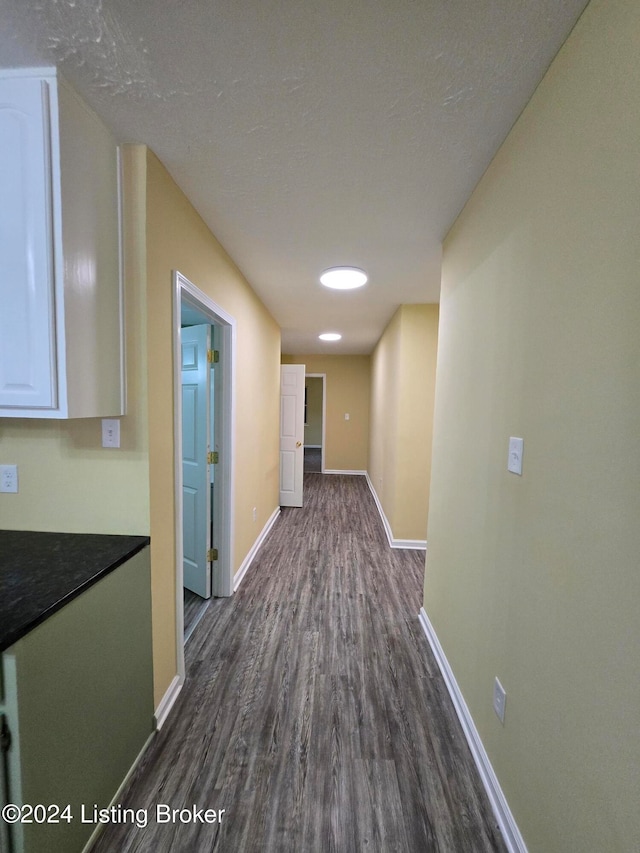 hall with dark hardwood / wood-style floors