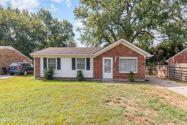 ranch-style house with a front lawn