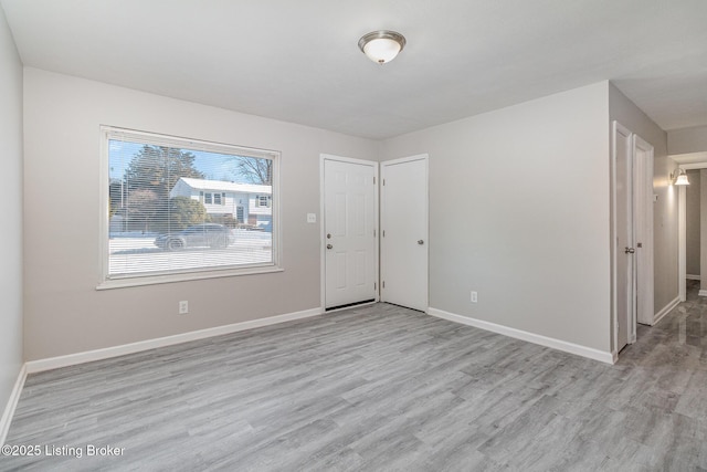 empty room with light wood-type flooring