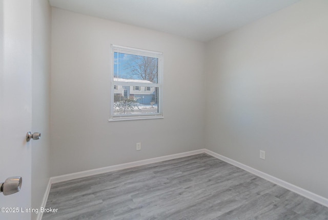 spare room featuring light hardwood / wood-style floors