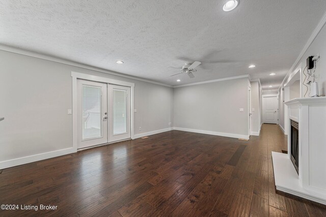 unfurnished living room with a textured ceiling, ornamental molding, dark hardwood / wood-style floors, and ceiling fan