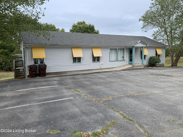 8910 Main St, Campbellsburg, KY 40011 - view of front of property with a shingled roof and uncovered parking