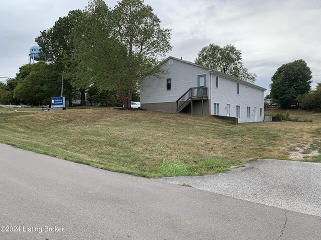 view of property exterior featuring a yard