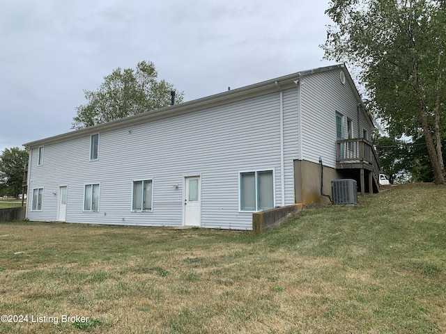 8910 Main St, Campbellsburg, KY 40011 - back of property with central AC unit and a yard