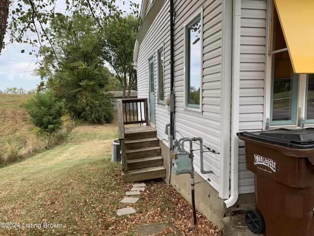 view of property exterior with a lawn