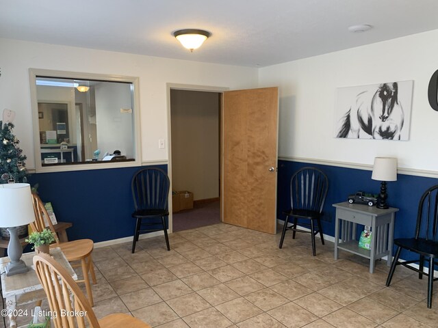 living area with tile patterned flooring