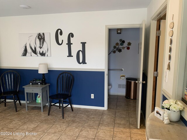 sitting room featuring tile patterned floors