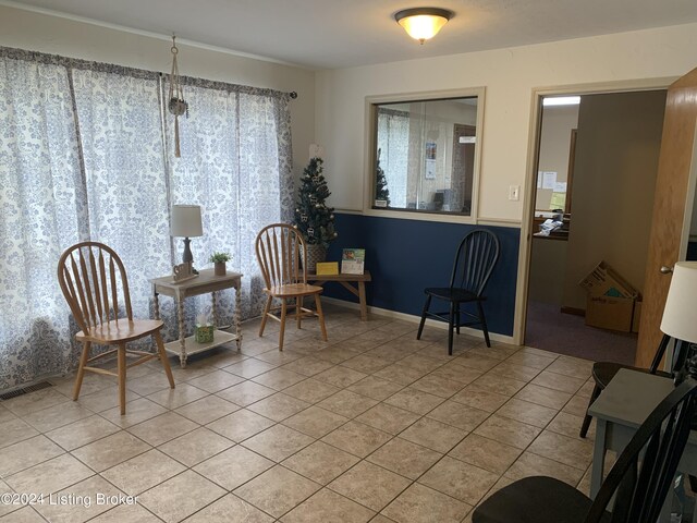 living area featuring light tile patterned flooring