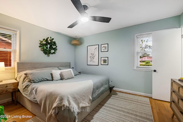 bedroom featuring light hardwood / wood-style floors and ceiling fan