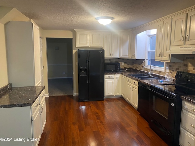 kitchen with black appliances, a textured ceiling, dark hardwood / wood-style floors, and tasteful backsplash