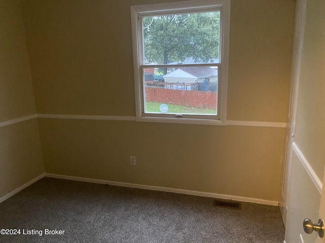 spare room featuring carpet flooring