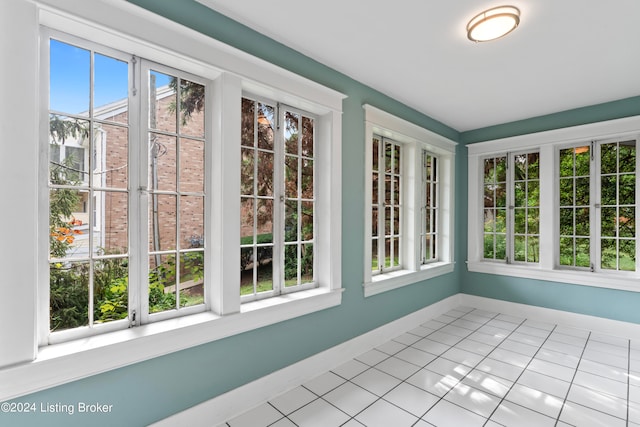 unfurnished sunroom featuring plenty of natural light