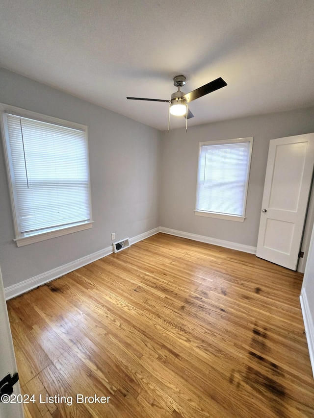 interior space with light hardwood / wood-style floors and ceiling fan