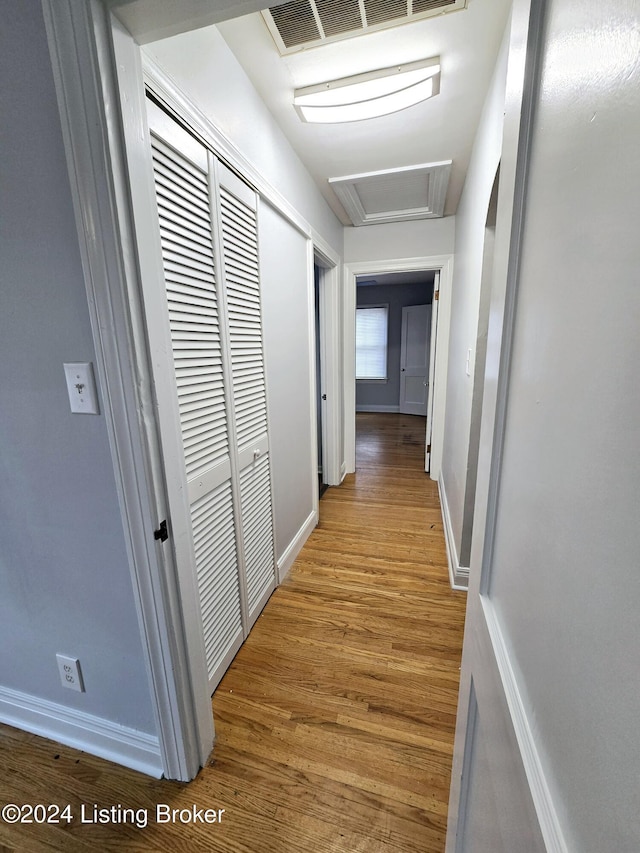 corridor featuring wood-type flooring