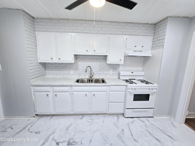 kitchen with white cabinets, ceiling fan, gas range gas stove, and sink