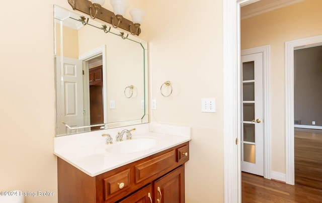 bathroom with vanity and hardwood / wood-style flooring